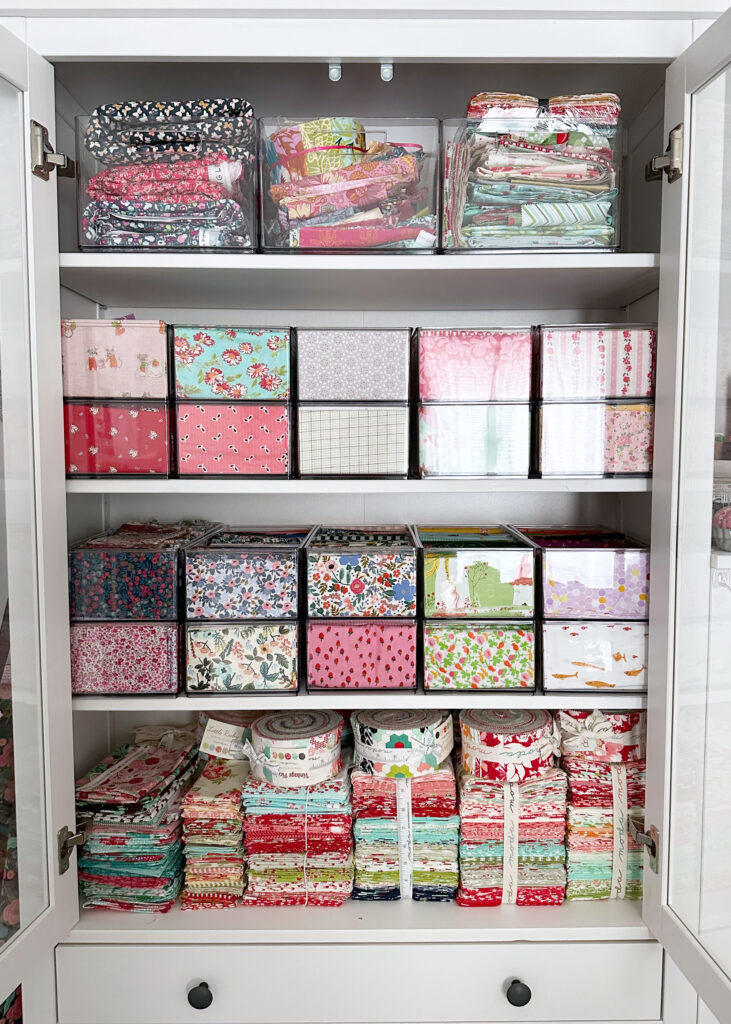 Cabinet with fabric in acrylic boxes for organization
