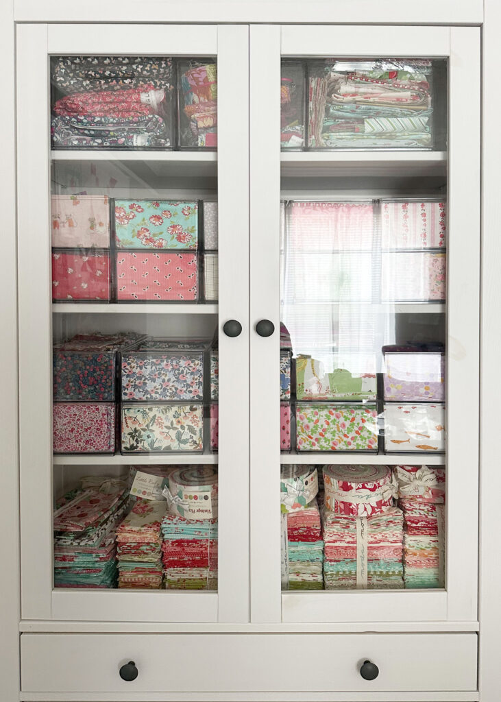 Cabinet closed with fabric stored in acrylic boxes