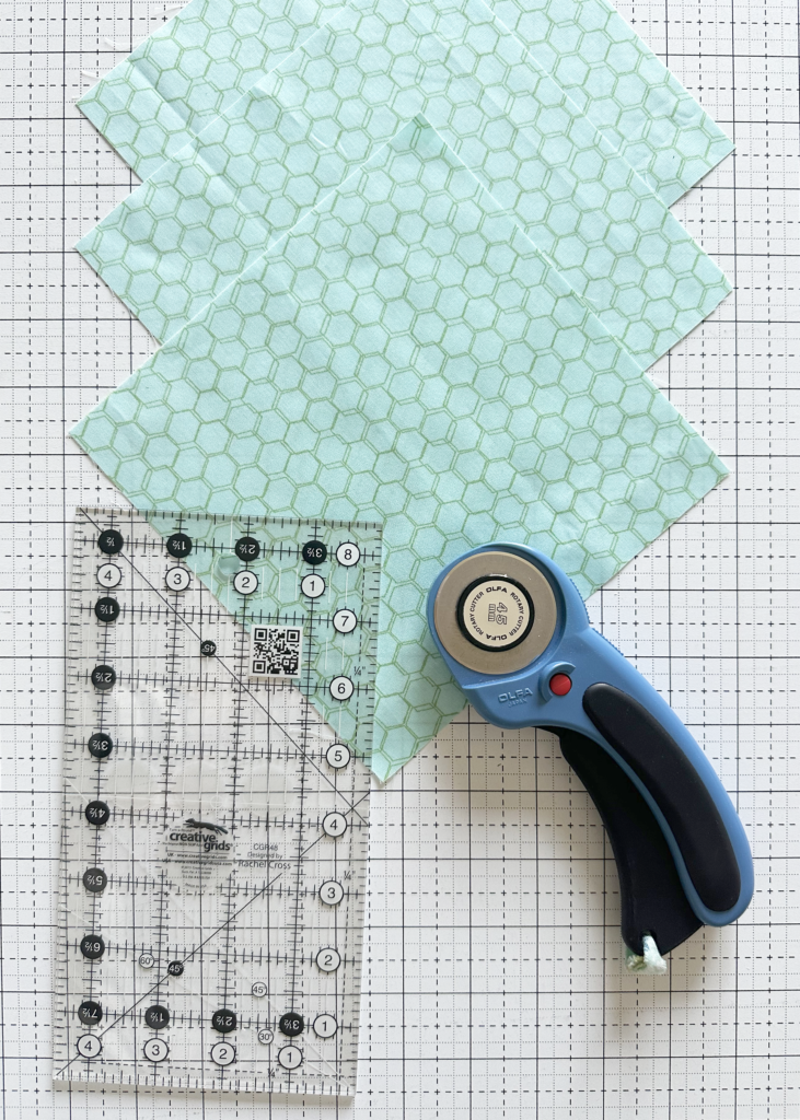 Rotary Cutter, fabric, and ruler