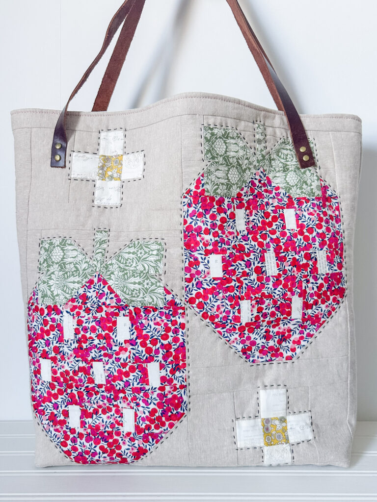 Strawberry Tote standing with white background